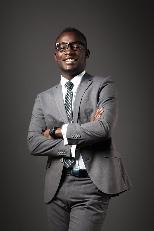 smiling-young-black-man-glasses-gray-business-suit-emotional-business-portrait-smiling-young-black-man-glasses-130576475